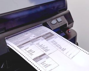 Photo of ballot feeding into ballot scanner